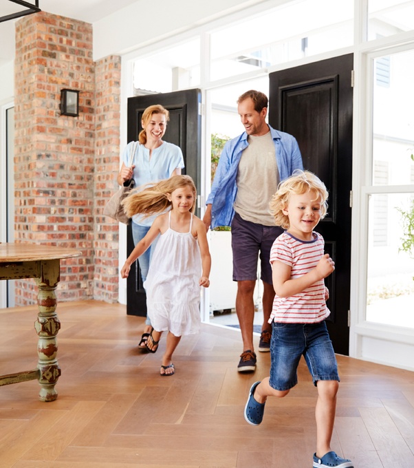 Family entering modern home